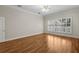Bright bedroom with hardwood floors and large windows providing ample natural light at 4518 W Woodmere Rd, Tampa, FL 33609