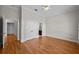This bedroom boasts hardwood floors, a ceiling fan, and crown molding at 4518 W Woodmere Rd, Tampa, FL 33609
