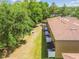 Aerial view of the back of the townhomes showing the backyard and patios at 4528 Winding River Way, Land O Lakes, FL 34639