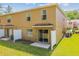 Back of townhome showing patio and view to the lawn at 4528 Winding River Way, Land O Lakes, FL 34639