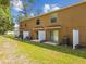 A shot of a group of the townhome patios and lawns at 4528 Winding River Way, Land O Lakes, FL 34639
