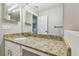 Bathroom featuring granite counters, light fixtures and neutral wall paint at 4528 Winding River Way, Land O Lakes, FL 34639