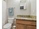 Bathroom featuring a granite countertop, neutral paint, mirror and shower at 4528 Winding River Way, Land O Lakes, FL 34639