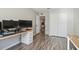 Bright bedroom features wood floors, closet, natural light, and neutral paint at 4528 Winding River Way, Land O Lakes, FL 34639