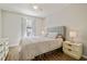 This bedroom features wood floors, a ceiling fan, and a neutral color palette at 4528 Winding River Way, Land O Lakes, FL 34639