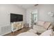 Bonus room with television and view into bedroom at 4528 Winding River Way, Land O Lakes, FL 34639