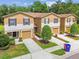 Inviting townhouse with well-manicured landscaping and attached garages at 4528 Winding River Way, Land O Lakes, FL 34639