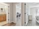 View of hallway featuring wood floors, bathroom and adjacent room with an office space at 4528 Winding River Way, Land O Lakes, FL 34639