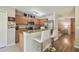Inviting kitchen with breakfast bar, stainless steel appliances, and modern lighting at 4528 Winding River Way, Land O Lakes, FL 34639