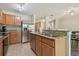 Spacious kitchen with breakfast bar, granite countertops and stainless steel appliances at 4528 Winding River Way, Land O Lakes, FL 34639