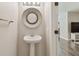 Powder room featuring modern fixtures and neutral paint at 4528 Winding River Way, Land O Lakes, FL 34639