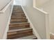 Wood staircase leading up to the second floor at 4528 Winding River Way, Land O Lakes, FL 34639