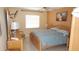Bedroom with a full bed, light colored walls and a window providing natural light at 4744 Azalea Dr # 203B, New Port Richey, FL 34652