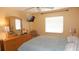Bedroom featuring a full bed, light-colored walls, ceiling fan and a window with blinds at 4744 Azalea Dr # 203B, New Port Richey, FL 34652