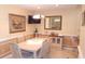 Dining area with chandelier lighting and large art piece on the wall at 4744 Azalea Dr # 203B, New Port Richey, FL 34652