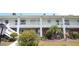 Charming two-story condo with red brick and well-maintained landscaping at 4744 Azalea Dr # 203B, New Port Richey, FL 34652