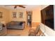 Inviting living room with a ceiling fan and an adjacent dining area with tile flooring at 4744 Azalea Dr # 203B, New Port Richey, FL 34652