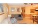 Comfortable living room features neutral colored furniture and bright natural light at 4744 Azalea Dr # 203B, New Port Richey, FL 34652