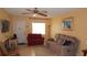 Charming living room featuring comfortable seating, tile flooring, and ample natural light at 4744 Azalea Dr # 203B, New Port Richey, FL 34652