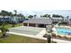 Well-maintained community pool, clubhouse, shuffleboard court and landscaped grounds at 4744 Azalea Dr # 203B, New Port Richey, FL 34652