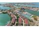 Aerial view highlighting condos, tennis courts, and waterfront access for a vibrant community at 511 Sandy Hook Rd, Treasure Island, FL 33706
