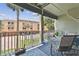 Inviting balcony features comfortable seating and relaxing views overlooking neighborhood at 511 Sandy Hook Rd, Treasure Island, FL 33706