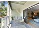 Charming balcony with seating area, ideal for relaxing and enjoying the serene outdoor views at 511 Sandy Hook Rd, Treasure Island, FL 33706