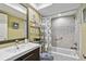 Bathroom featuring shower/tub combination and neutral color scheme with tile accents at 511 Sandy Hook Rd, Treasure Island, FL 33706