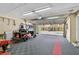 Garage equipped with an electric golf cart, and outdoor recreational items at 511 Sandy Hook Rd, Treasure Island, FL 33706