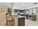 Modern kitchen features stainless steel appliances, granite countertops, bar seating, and a wine cooler at 511 Sandy Hook Rd, Treasure Island, FL 33706