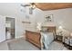 Bright main bedroom features a high ceiling, neutral decor, and plush carpet at 511 Sandy Hook Rd, Treasure Island, FL 33706