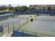 Multiple tennis courts with well maintained blue and green surfaces available for residents and guests at 511 Sandy Hook Rd, Treasure Island, FL 33706