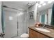 Bathroom showcasing shower, vanity, granite countertop, and neutral color palette at 5582 Baywater Dr, Tampa, FL 33615