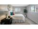 Relaxing bedroom with comfortable bed, neutral decor, and natural light at 5582 Baywater Dr, Tampa, FL 33615