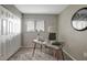 Inviting home office featuring modern desk, neutral tones, and a window for natural light at 5582 Baywater Dr, Tampa, FL 33615