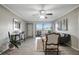 Inviting living room with hardwood floors, stylish decor, and balcony access at 5582 Baywater Dr, Tampa, FL 33615