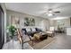 Comfortable living room with sleek flooring, modern decor, and lots of natural light at 5582 Baywater Dr, Tampa, FL 33615