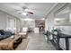 Bright living space showcasing a kitchen view, hardwood floors and elegant decor at 5582 Baywater Dr, Tampa, FL 33615