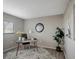 Home office setup with a unique metal desk, area rug, decorative art, and modern decor at 5582 Baywater Dr, Tampa, FL 33615