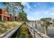 Scenic waterfront view with condos, a boardwalk, and serene canal at 5582 Baywater Dr, Tampa, FL 33615