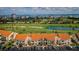 Wide aerial view showcasing community buildings, a golf course and waterfront skyline at 6151 Bahia Del Mar Blvd # 126, St Petersburg, FL 33715