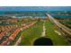 Expansive aerial view featuring community, golf course, Intracoastal Waterway and a bridge at 6151 Bahia Del Mar Blvd # 126, St Petersburg, FL 33715