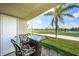 Charming balcony with outdoor seating and scenic views of the adjacent golf course and lush greenery at 6151 Bahia Del Mar Blvd # 126, St Petersburg, FL 33715