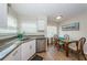 Cozy dining area featuring granite countertops, stainless steel appliances, and a breakfast table at 6151 Bahia Del Mar Blvd # 126, St Petersburg, FL 33715