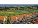 Condominium community overlooking a golf course with water views on a sunny day at 6151 Bahia Del Mar Blvd # 126, St Petersburg, FL 33715