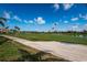 Stunning view of the golf course featuring manicured greens, blue skies, and palm tree accents at 6151 Bahia Del Mar Blvd # 126, St Petersburg, FL 33715