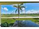 Charming golf course view from the patio with lush greenery, blue skies, and a peaceful atmosphere at 6151 Bahia Del Mar Blvd # 126, St Petersburg, FL 33715