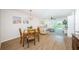 Open floor plan with living and dining areas, featuring hardwood floors and lots of natural light at 6151 Bahia Del Mar Blvd # 126, St Petersburg, FL 33715