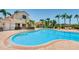 Inviting community pool with tropical landscaping and comfortable lounge seating at 6151 Bahia Del Mar Blvd # 126, St Petersburg, FL 33715