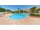 Inviting community pool features cool blue water and a brick paver deck at 6151 Bahia Del Mar Blvd # 126, St Petersburg, FL 33715